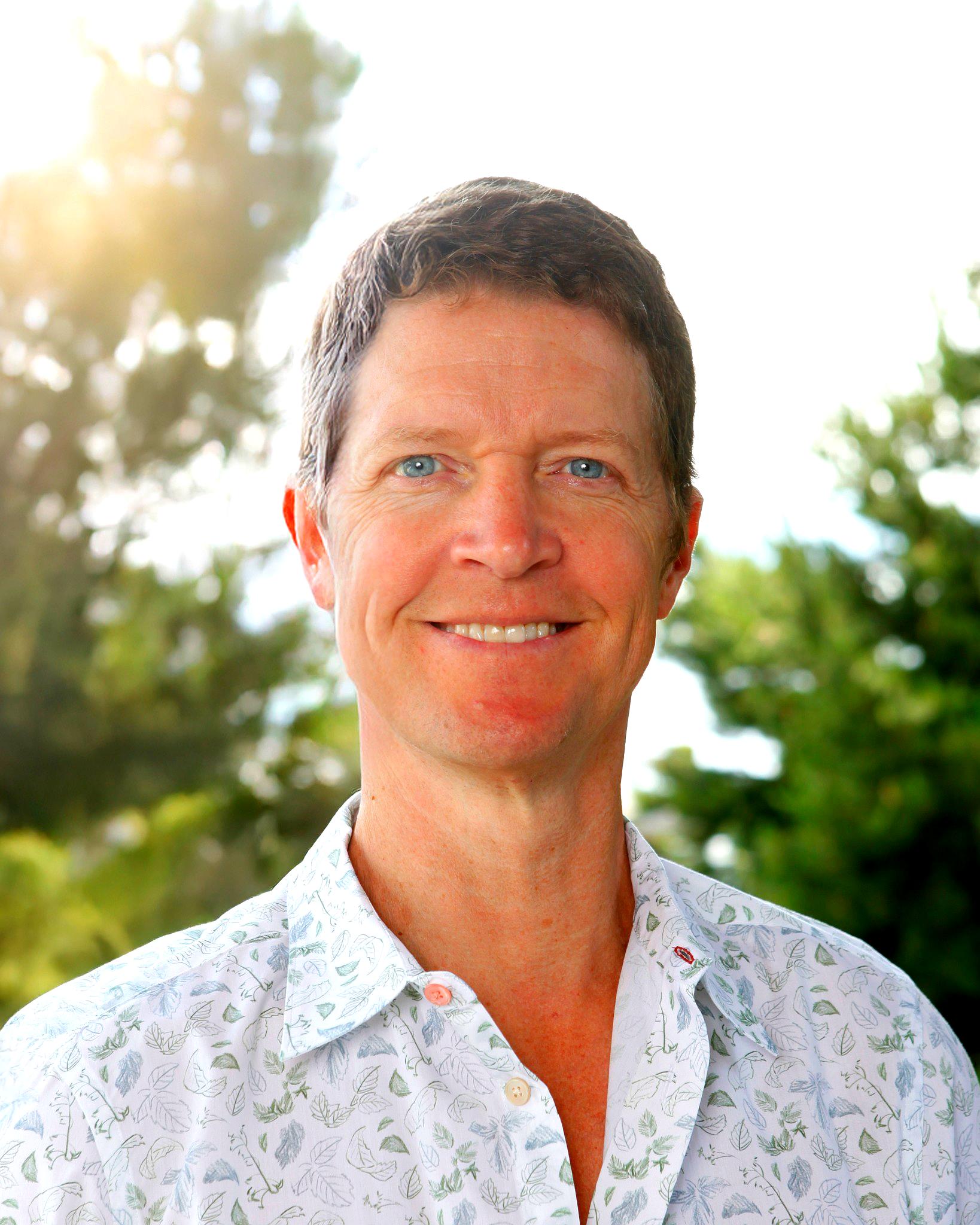 Christian Chabot in casual shirt with trees in the background