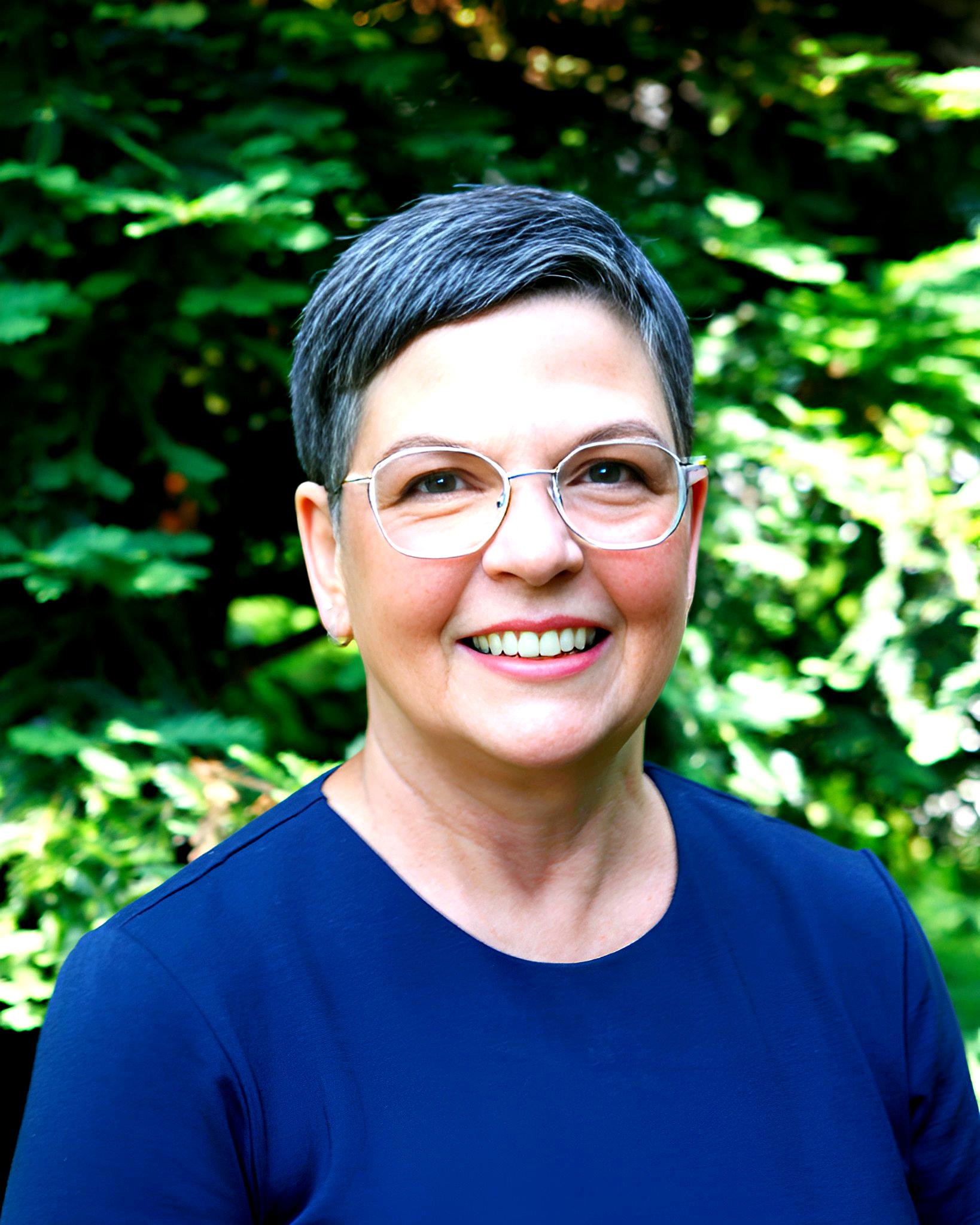 Laurie Ackles in a green garden